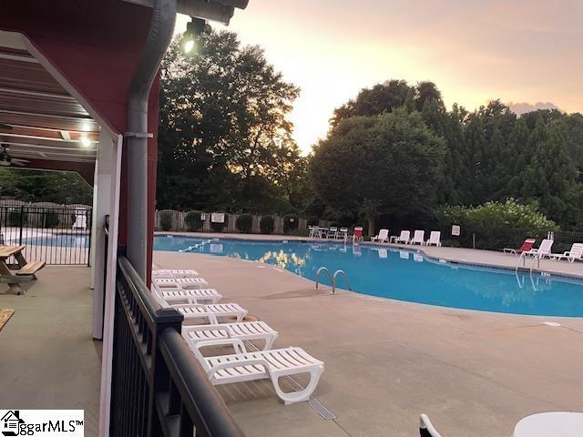 112 Pendock Ln, Piedmont, SC 29673 - pool at dusk with a patio and a community pool