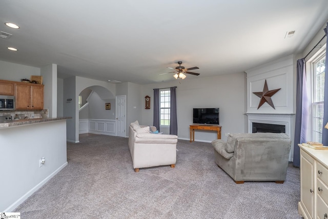 112 Pendock Ln, Piedmont, SC 29673 - living area featuring arched walkways, ceiling fan, a fireplace, light colored carpet, and recessed lighting