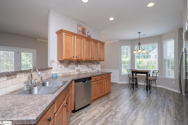 112 Pendock Ln, Piedmont, SC 29673 - kitchen with stainless steel appliances, recessed lighting, tasteful backsplash, light wood-type flooring, and decorative light fixtures