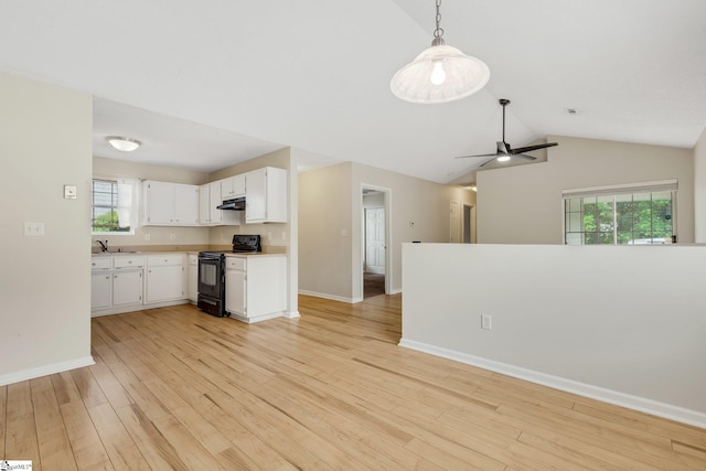 21 Lantern Ln, Greer, SC 29651 - kitchen with electric range, light countertops, light wood finished floors, under cabinet range hood, and open floor plan