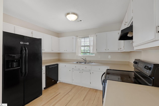 21 Lantern Ln, Greer, SC 29651 - kitchen with black appliances, under cabinet range hood, light wood-style flooring, and white cabinets