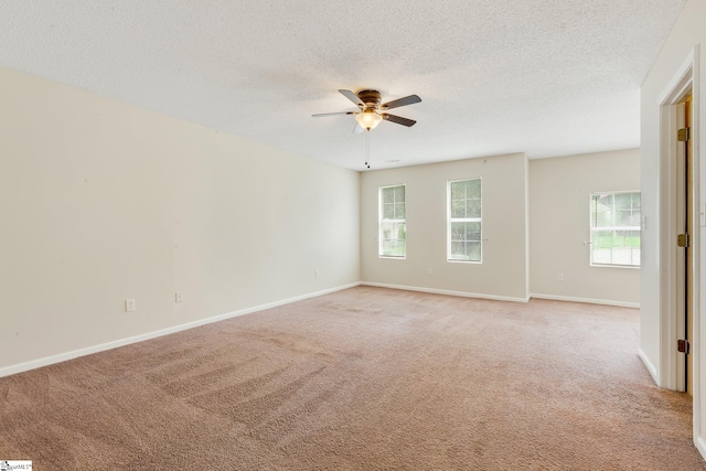 21 Lantern Ln, Greer, SC 29651 - empty room featuring ceiling fan, light colored carpet, healthy amount of natural light, and a textured ceiling