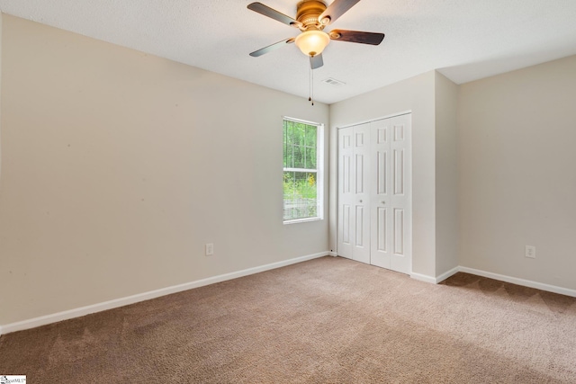 21 Lantern Ln, Greer, SC 29651 - unfurnished bedroom with light colored carpet, a closet, and ceiling fan