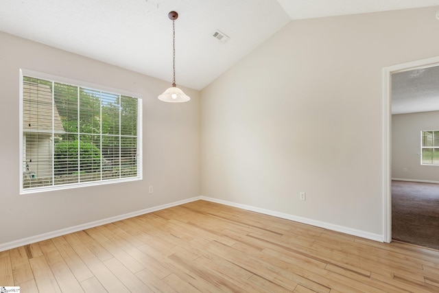 21 Lantern Ln, Greer, SC 29651 - unfurnished room featuring lofted ceiling and light wood-type flooring