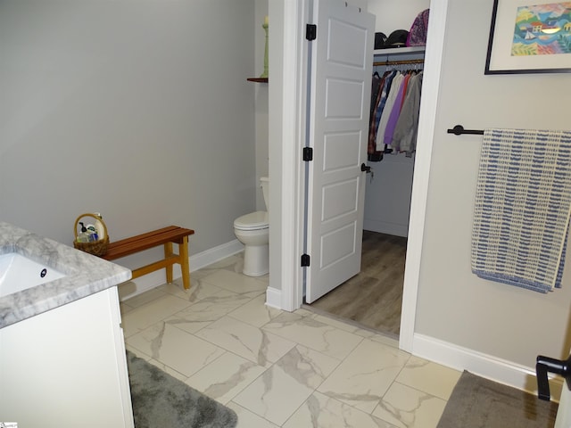 811 White Magnolia Dr, Inman, SC 29349 - bathroom featuring vanity, marble look tiles, and a spacious closet