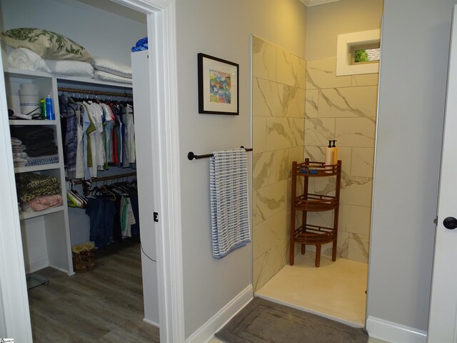 811 White Magnolia Dr, Inman, SC 29349 - bathroom with a walk in shower, wood finished floors, and a walk in closet