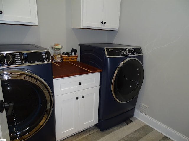 811 White Magnolia Dr, Inman, SC 29349 - laundry room with cabinet space and washing machine and dryer