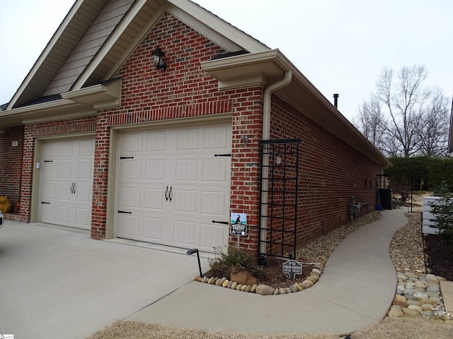 811 White Magnolia Dr, Inman, SC 29349 - view of side of home with brick siding, driveway, and an attached garage