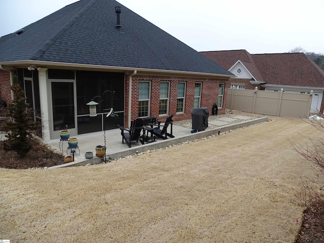 811 White Magnolia Dr, Inman, SC 29349 - back of house with brick siding, a patio, and roof with shingles