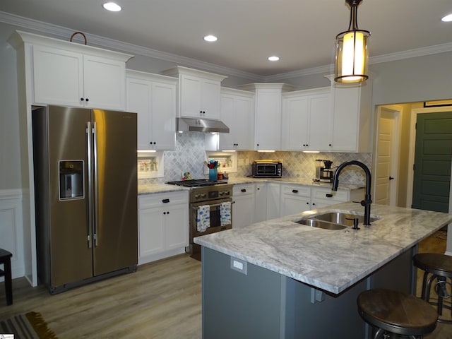 811 White Magnolia Dr, Inman, SC 29349 - kitchen featuring appliances with stainless steel finishes, white cabinetry, a breakfast bar, light wood-type flooring, and light stone counters