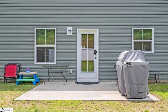 243 Lily Park Way, Easley, SC 29642 - property entrance with a patio and a lawn