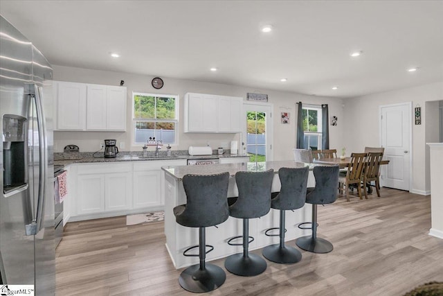 243 Lily Park Way, Easley, SC 29642 - kitchen featuring appliances with stainless steel finishes, plenty of natural light, light stone counters, and recessed lighting