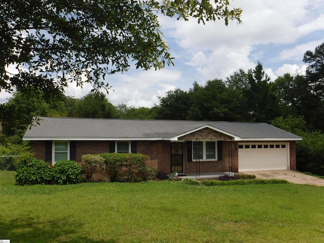 279 Finch Rd, Wellford, SC 29385 - ranch-style house featuring a garage, brick siding, a front lawn, and driveway