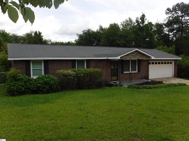 279 Finch Rd, Wellford, SC 29385 - ranch-style house featuring brick siding, a garage, a front yard, and driveway
