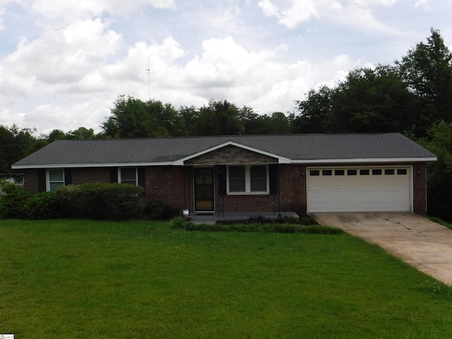279 Finch Rd, Wellford, SC 29385 - single story home featuring a garage, concrete driveway, a front yard, and brick siding