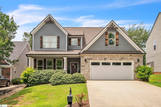 542 Drayton Hall Blvd, Duncan, SC 29334 - craftsman inspired home with driveway, a front lawn, a garage, roof with shingles, and stone siding