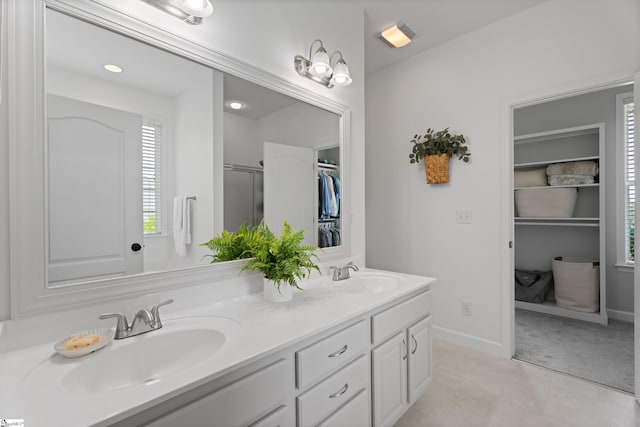 104 Superior Way, Greer, SC 29651 - full bathroom featuring a spacious closet, double vanity, healthy amount of natural light, and an enclosed shower