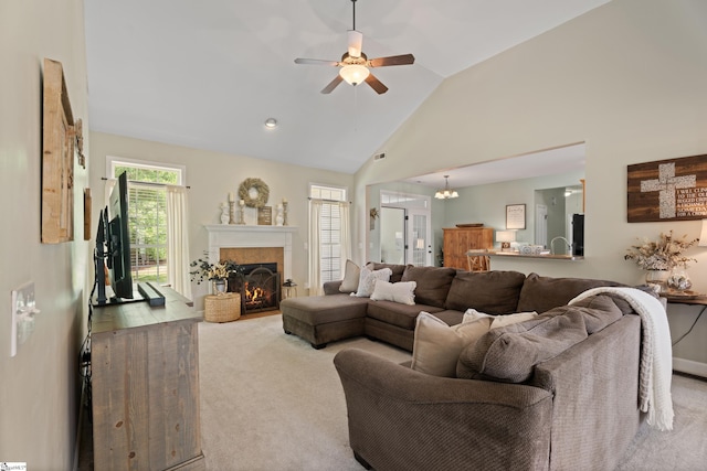 104 Superior Way, Greer, SC 29651 - carpeted living area with a ceiling fan, a fireplace with flush hearth, high vaulted ceiling, and a chandelier