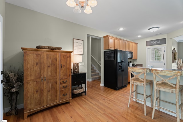 104 Superior Way, Greer, SC 29651 - kitchen featuring black appliances, light wood-type flooring, a chandelier, and recessed lighting