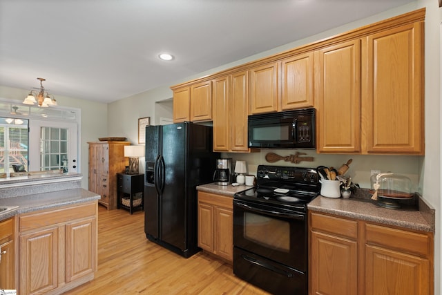 104 Superior Way, Greer, SC 29651 - kitchen featuring black appliances, a chandelier, light wood-style floors, hanging light fixtures, and recessed lighting