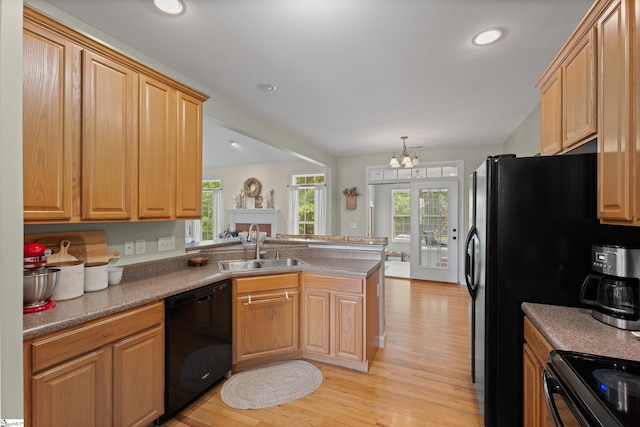 104 Superior Way, Greer, SC 29651 - kitchen featuring black appliances, a peninsula, light wood-style flooring, a chandelier, and recessed lighting