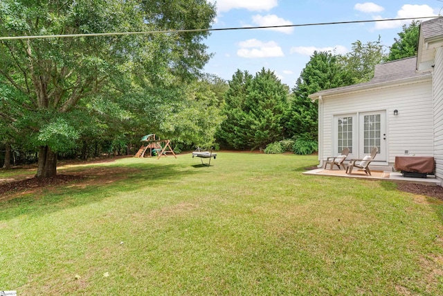 104 Superior Way, Greer, SC 29651 - view of grassy yard featuring a playground and a patio area