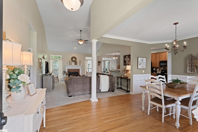 104 Superior Way, Greer, SC 29651 - dining area featuring a fireplace, ceiling fan, a chandelier, light wood-style floors, and ornamental molding