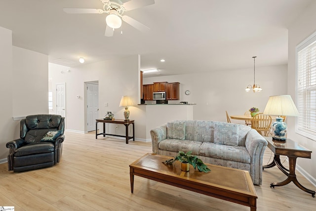 6 Castle Hall Ct, Simpsonville, SC 29681 - living area with light wood-style flooring, healthy amount of natural light, ceiling fan, a chandelier, and recessed lighting
