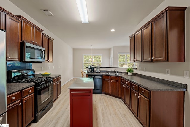 6 Castle Hall Ct, Simpsonville, SC 29681 - kitchen featuring black appliances, light wood-type flooring, a peninsula, recessed lighting, and a center island