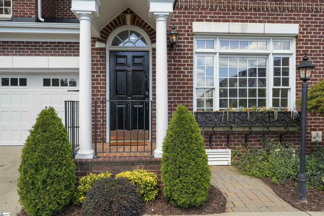 623 N Main St Unit Iii, Unit Iii, Greenville, SC 29601 - view of exterior entry with brick siding and a garage