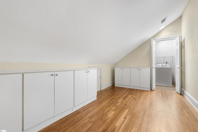 623 N Main St Unit Iii, Unit Iii, Greenville, SC 29601 - additional living space with washer / clothes dryer, lofted ceiling, and light wood-style floors