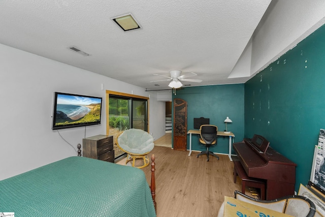 2701 Cobbs Way, Anderson, SC 29621 - bedroom featuring wood finished floors, an office area, a textured ceiling, and a ceiling fan