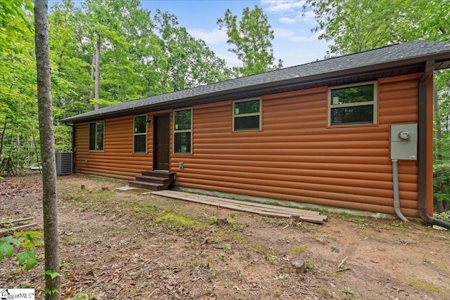 1150 Chinquapin Rd, Travelers Rest, SC 29690 - view of property exterior featuring log veneer siding, roof with shingles, and entry steps