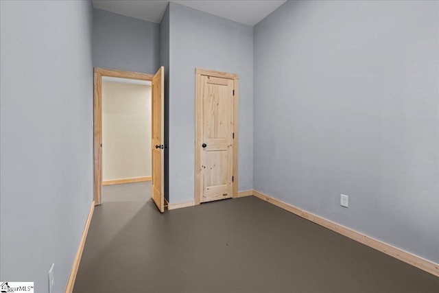 1150 Chinquapin Rd, Travelers Rest, SC 29690 - unfurnished bedroom with finished concrete floors and baseboards