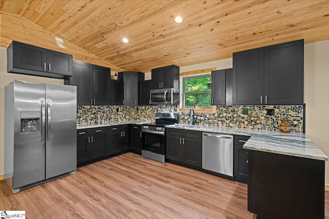1150 Chinquapin Rd, Travelers Rest, SC 29690 - kitchen with appliances with stainless steel finishes, vaulted ceiling, wooden ceiling, light stone counters, and light wood-style flooring