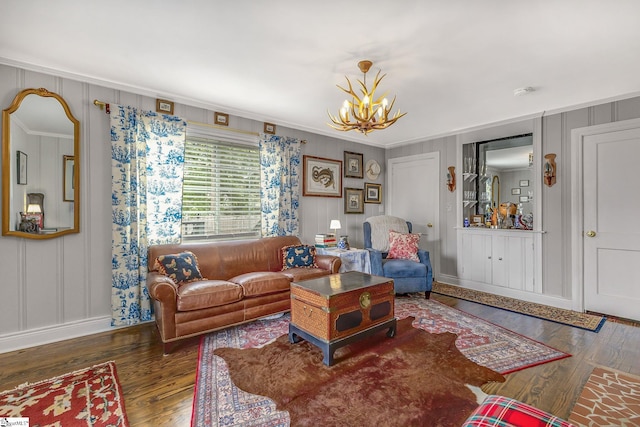 2109 Hudson Rd, Greer, SC 29650 - living room with crown molding, a decorative wall, wood finished floors, and a chandelier