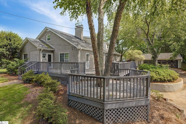 2109 Hudson Rd, Greer, SC 29650 - rear view of house with a deck, a chimney, and brick siding