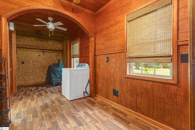 2109 Hudson Rd, Greer, SC 29650 - washroom featuring washer / dryer, arched walkways, wood walls, ceiling fan, and wood finished floors