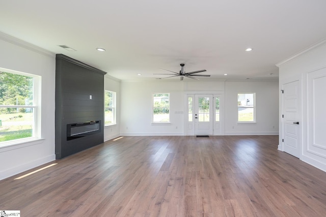 103 Cedar Falls Rd, Fountain Inn, SC 29644 - unfurnished living room featuring ornamental molding, plenty of natural light, recessed lighting, a large fireplace, and a ceiling fan