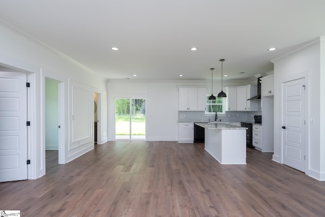 103 Cedar Falls Rd, Fountain Inn, SC 29644 - kitchen with crown molding, healthy amount of natural light, wall chimney range hood, open floor plan, and a kitchen island