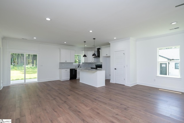 103 Cedar Falls Rd, Fountain Inn, SC 29644 - unfurnished living room with healthy amount of natural light, crown molding, dark wood-type flooring, and recessed lighting
