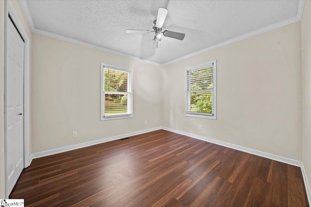 121 Chesterfield Ct, Easley, SC 29640 - unfurnished bedroom with dark wood-style floors, multiple windows, a textured ceiling, a closet, and ornamental molding