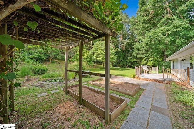 121 Chesterfield Ct, Easley, SC 29640 - view of green lawn featuring a wooden deck, a garden, and a pergola