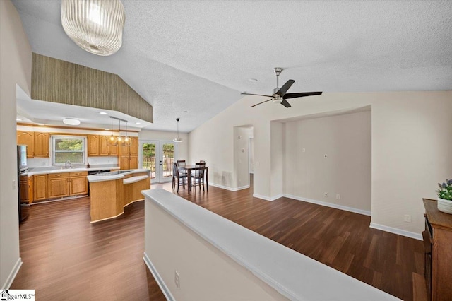 121 Chesterfield Ct, Easley, SC 29640 - living room featuring dark wood-style flooring, french doors, ceiling fan, a textured ceiling, and lofted ceiling