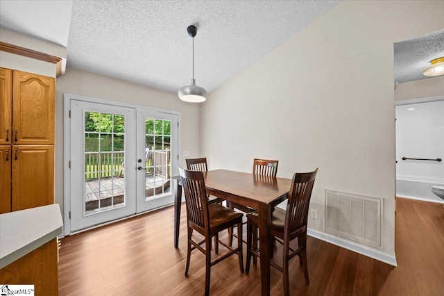 121 Chesterfield Ct, Easley, SC 29640 - dining room with a textured ceiling, dark wood-type flooring, and french doors