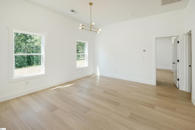 200 Folk Rd, Chesnee, SC 29323 - spare room with a chandelier and light wood-type flooring