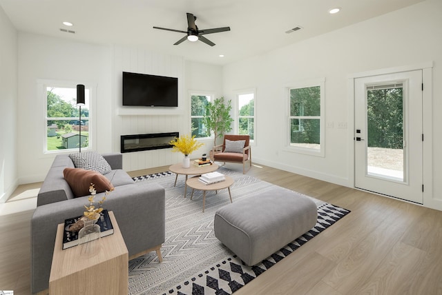 200 Folk Rd, Chesnee, SC 29323 - living room featuring light wood-type flooring, a large fireplace, a ceiling fan, and recessed lighting