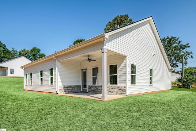 200 Folk Rd, Chesnee, SC 29323 - back of house with a ceiling fan, a patio area, a yard, and stone siding