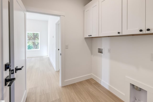 196 Folk Rd, Chesnee, SC 29323 - washroom featuring cabinet space, washer hookup, and light wood-type flooring