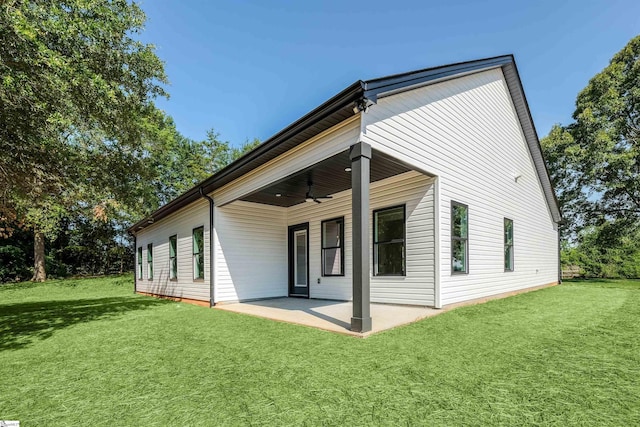 196 Folk Rd, Chesnee, SC 29323 - back of property featuring ceiling fan, a patio, and a lawn